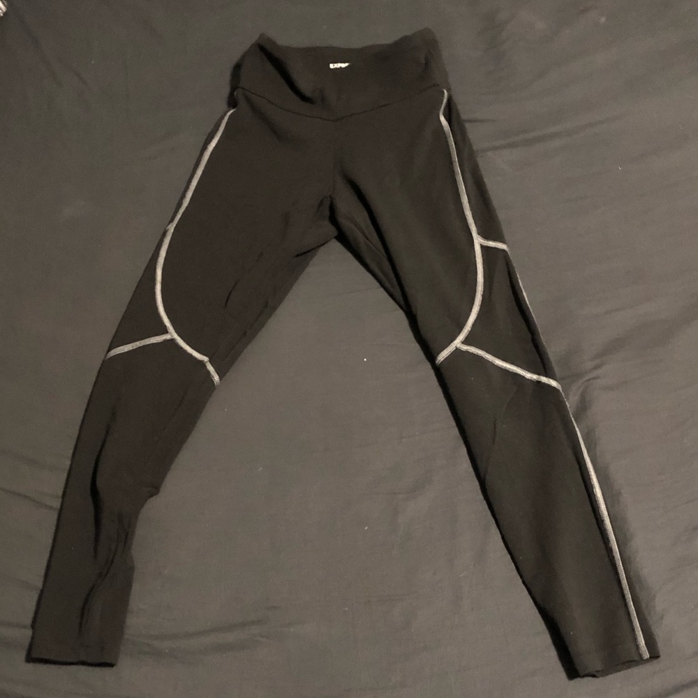 black stretchy leggings white sewed atripes along sides and knees